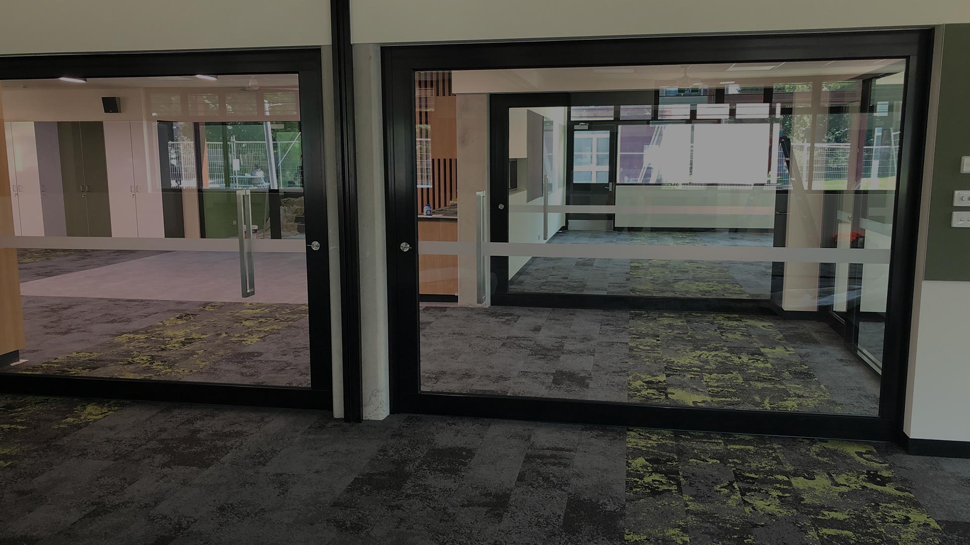image of glazed acoustic sliding doors that are DDA compliant