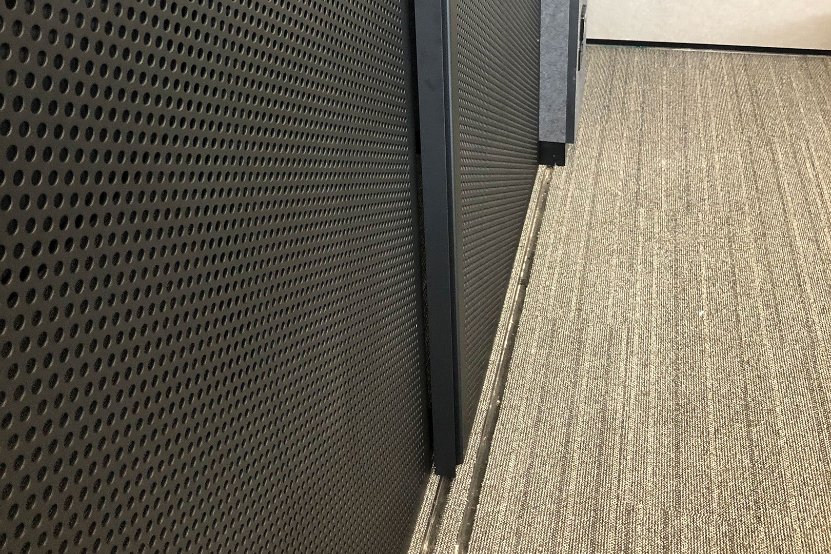 image of a track system of architectural privacy sliding screens at a school