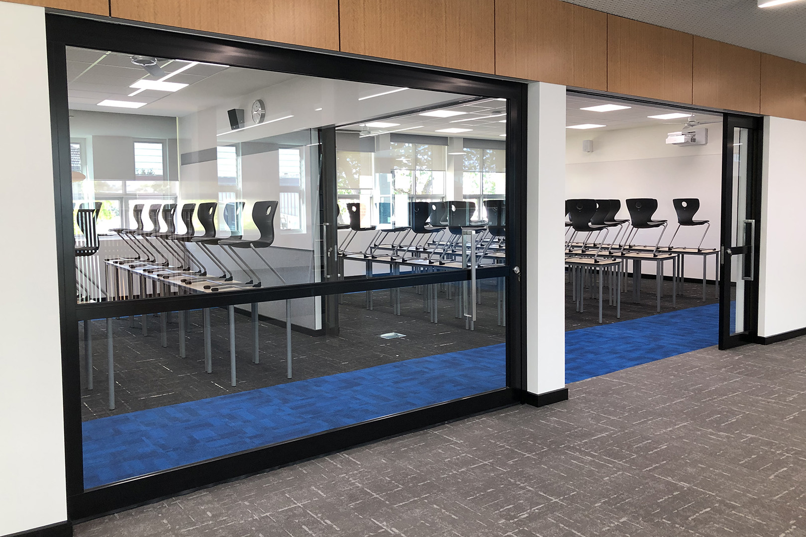 image of acoustic sliding doors installed inside a secondary school