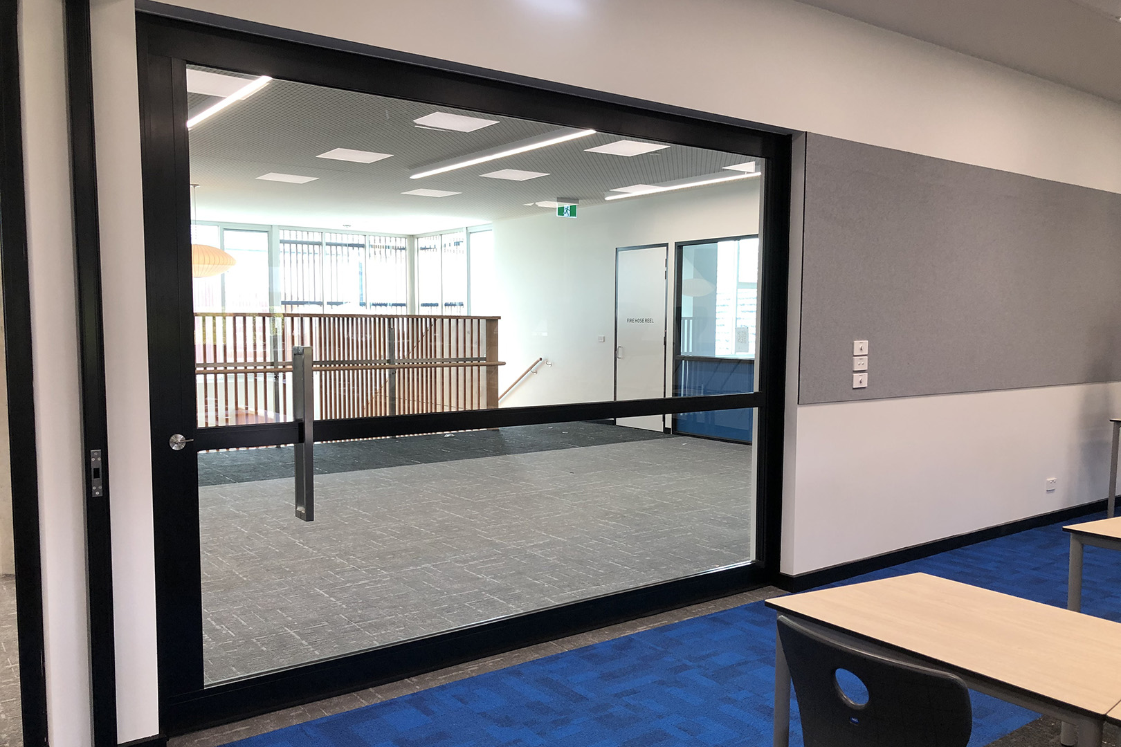 image of acoustic sliders in a school used to create flexible learning rooms