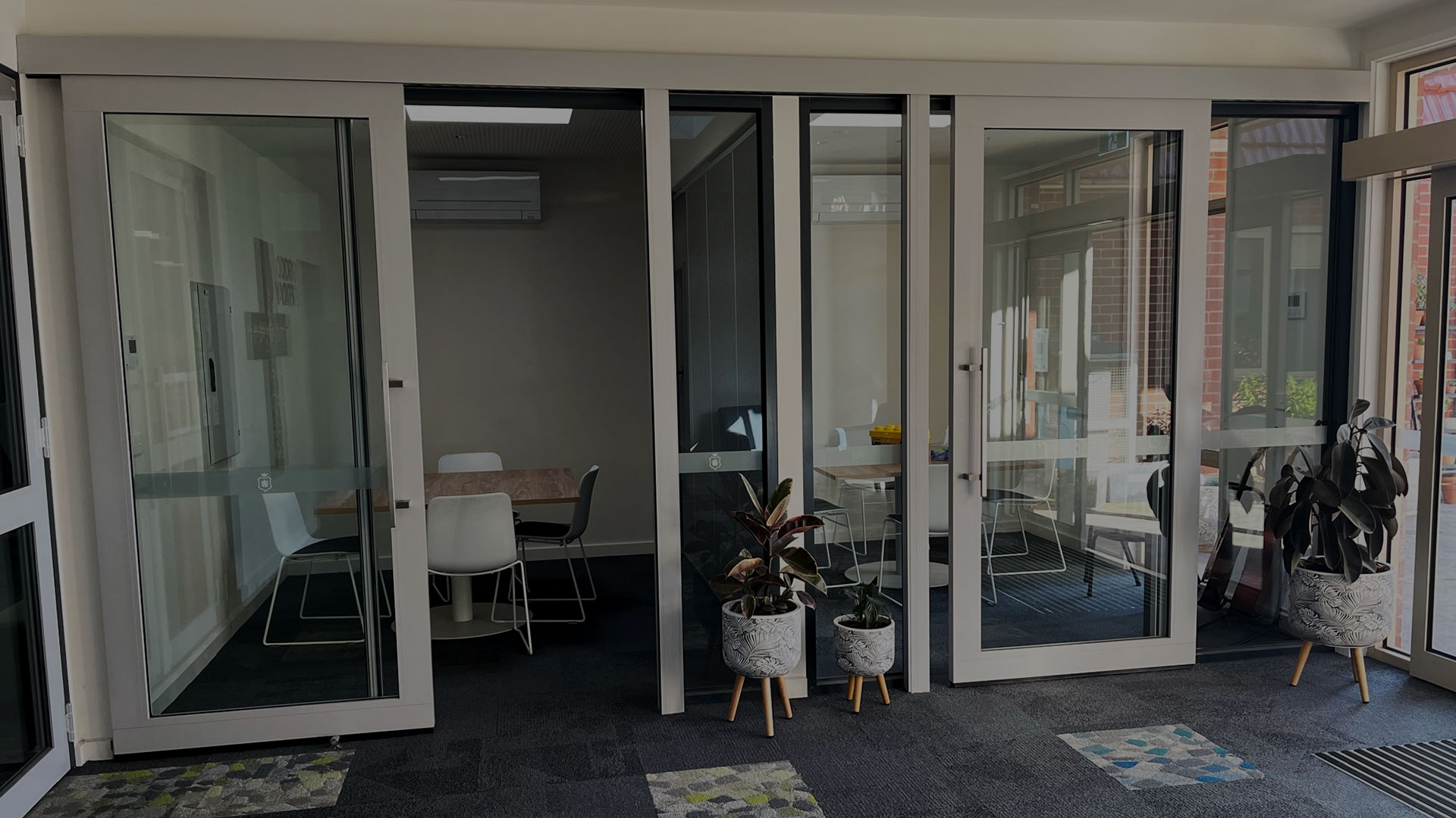 Glazed acoustic sliding door systems