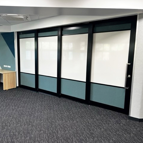 operable wall system with solid panels and whiteboards