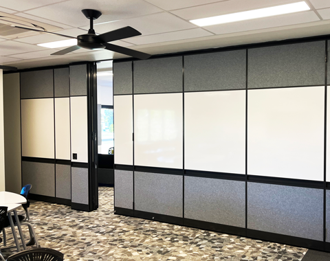 Movable wall system in a school with whiteboard insets