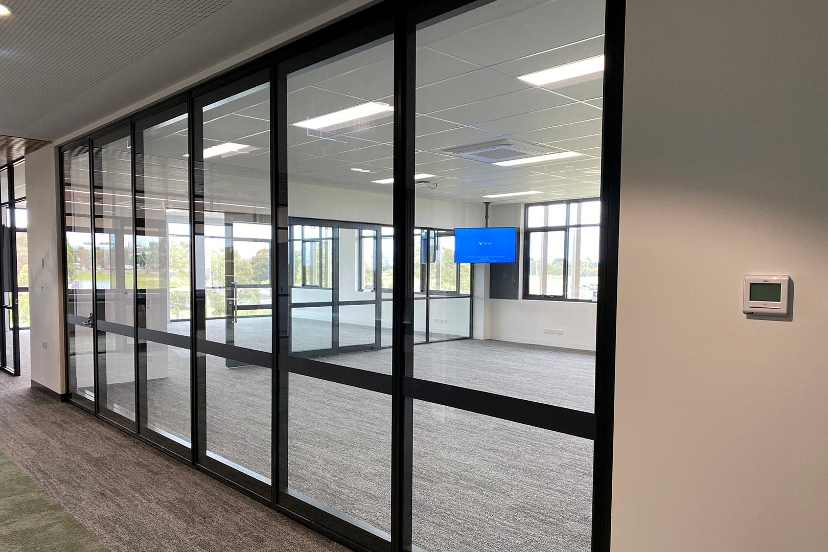 flexible use classrooms created with glazed sliding doors and glazed operable walls