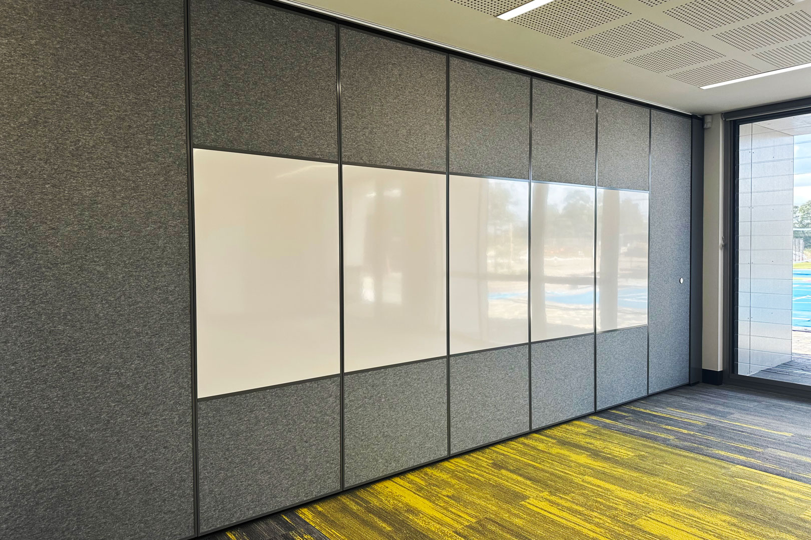 Optica operable wall system with pinboards and inset whiteboards