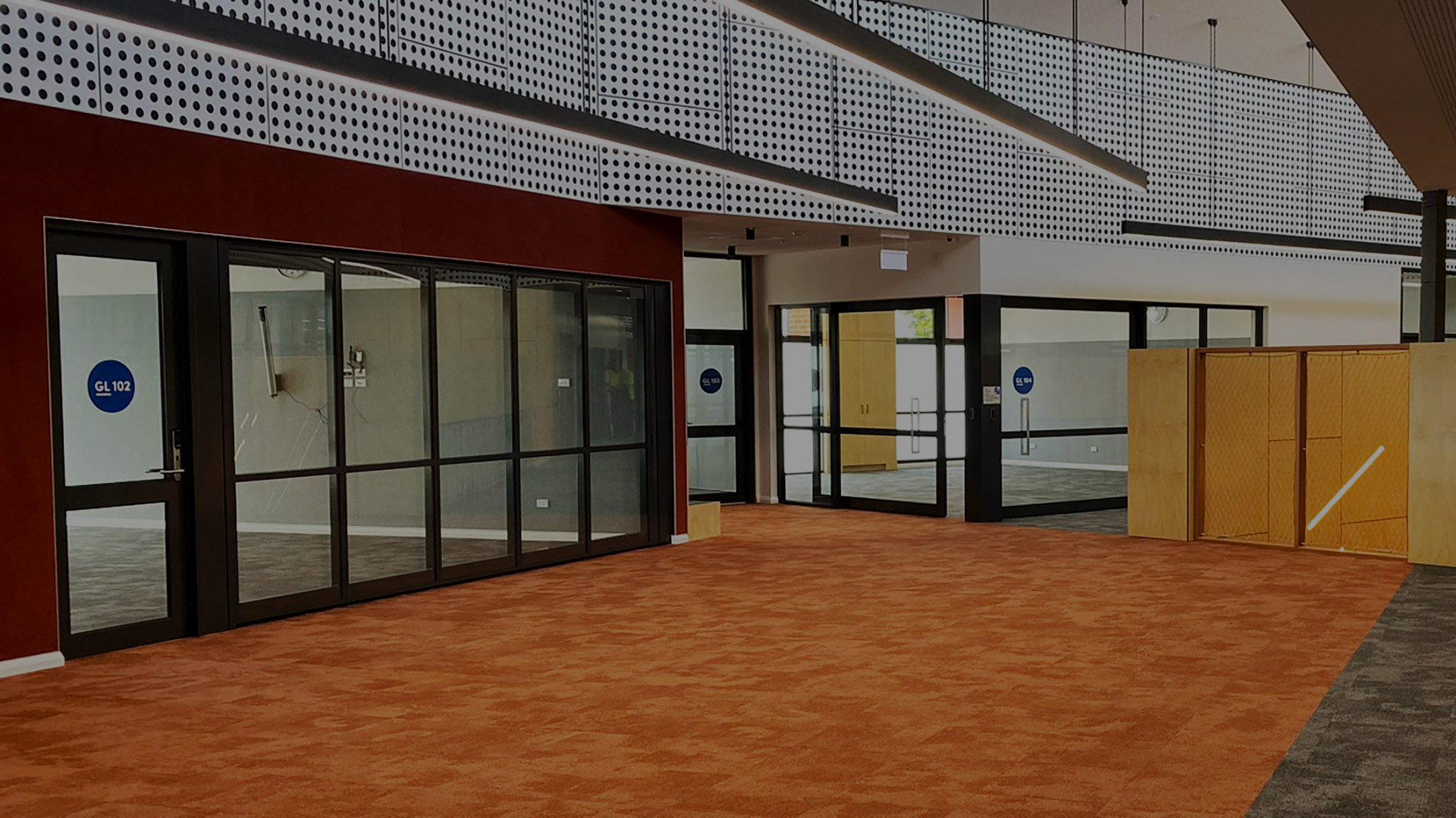 glazed acoustic sliding door and operablw walls installed in a school