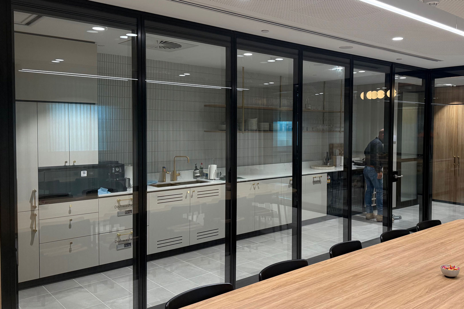 Optica glazed operable wall for internal fitout space