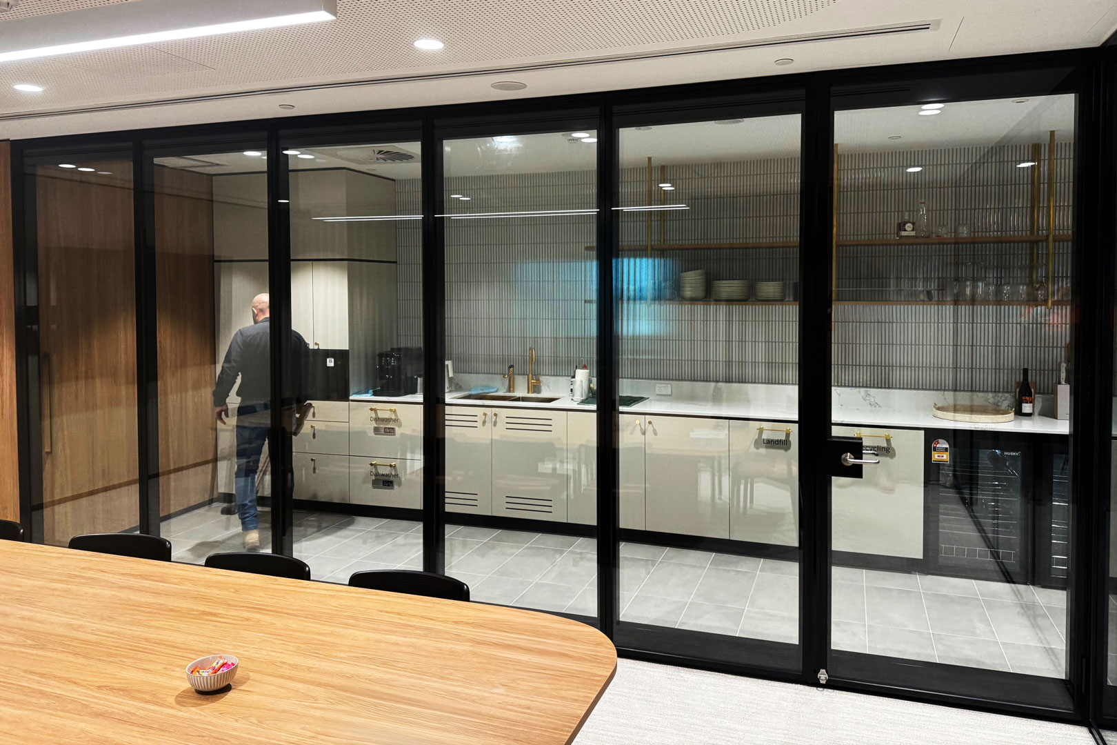 Optica glazed operable wall for office fitout space