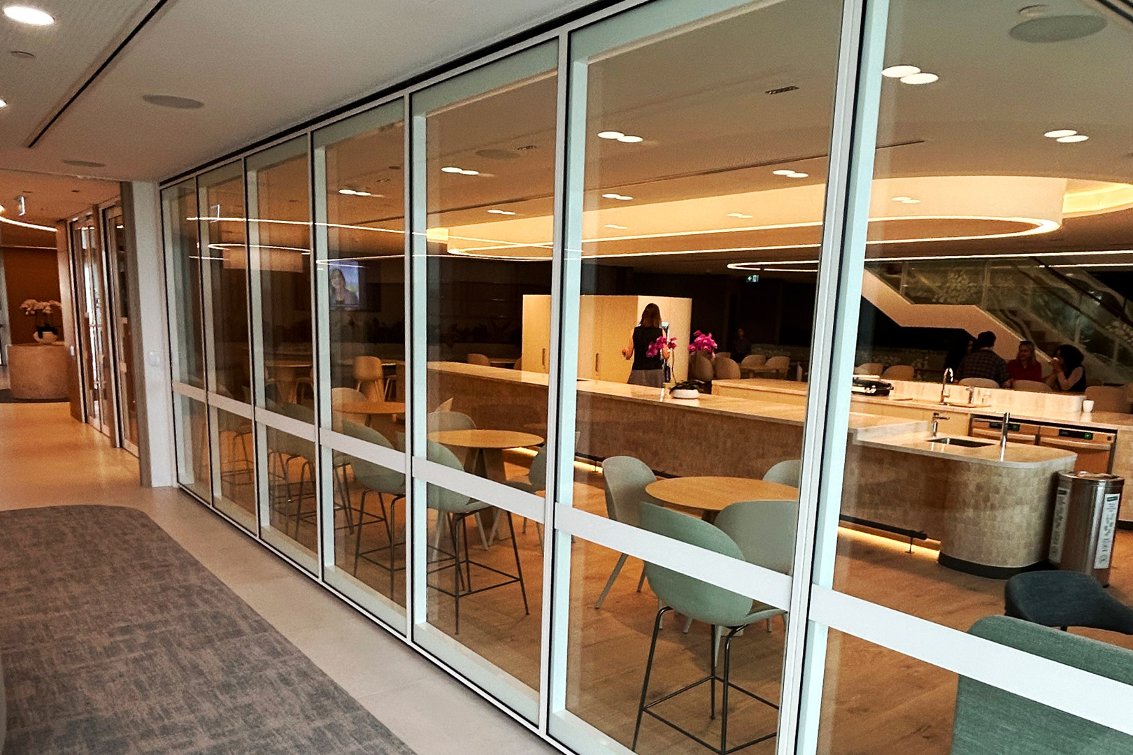 Remote stack glazed operable wall for commercial fitout