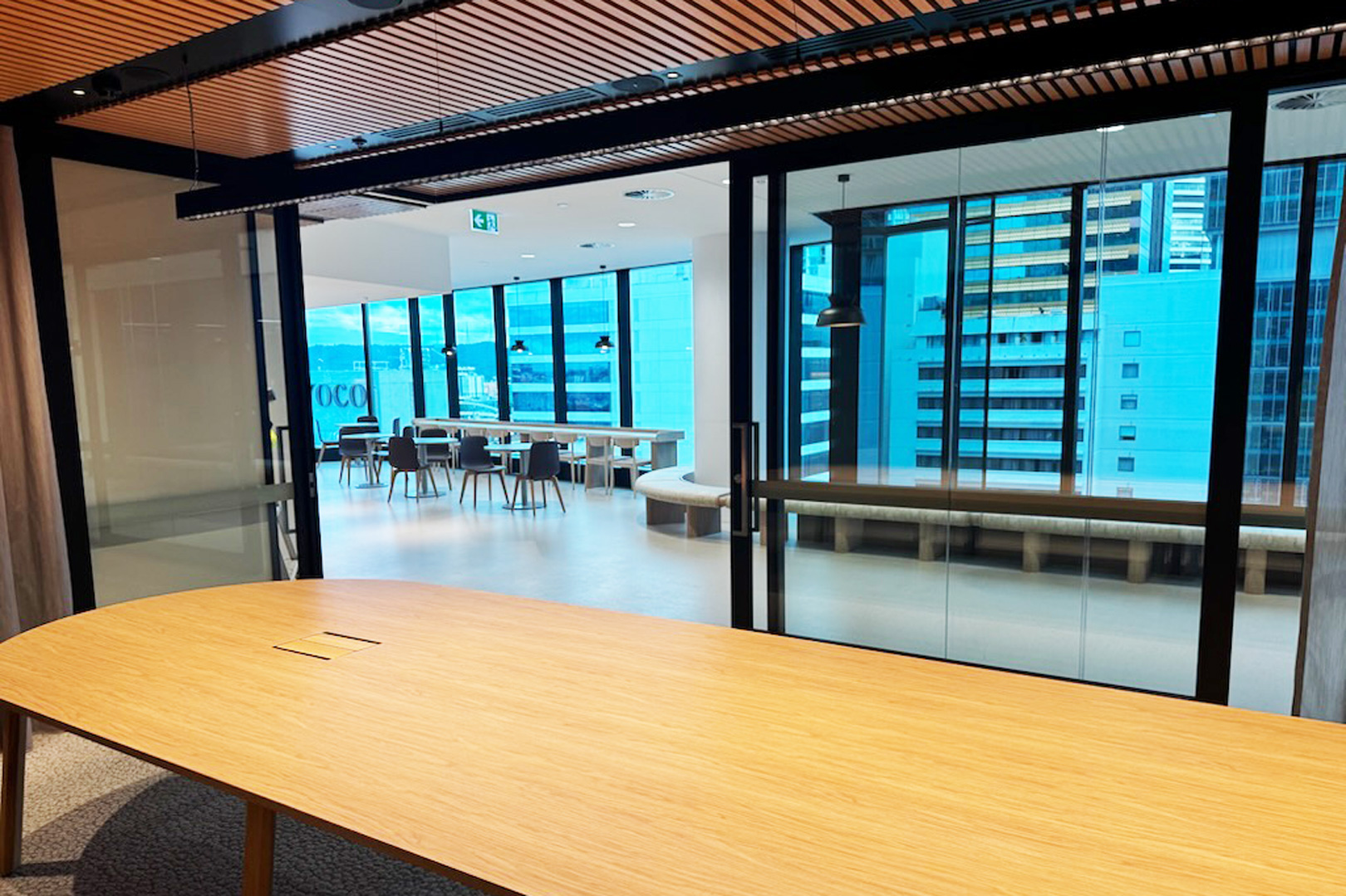 Commercial fitout Rw37 rated bi-parting acoustic sliding door