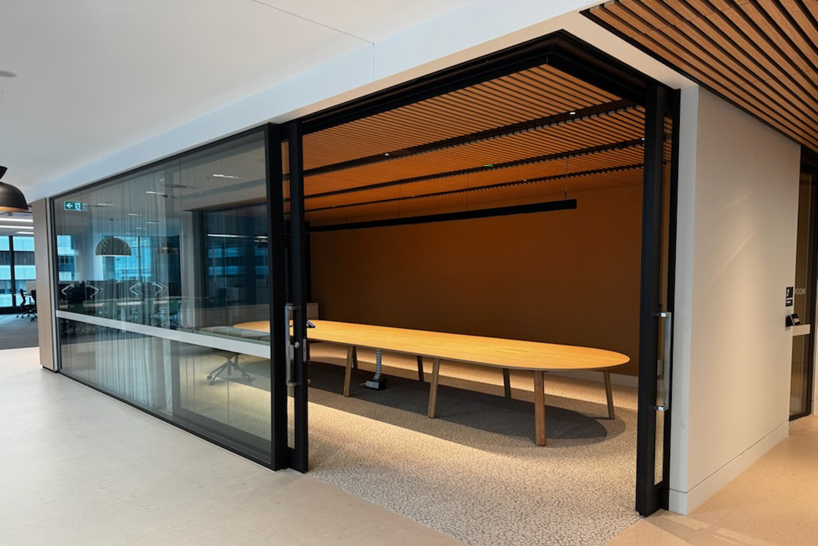 90 degree Rw37 rated bi-parting acoustic slider for commercial fitout