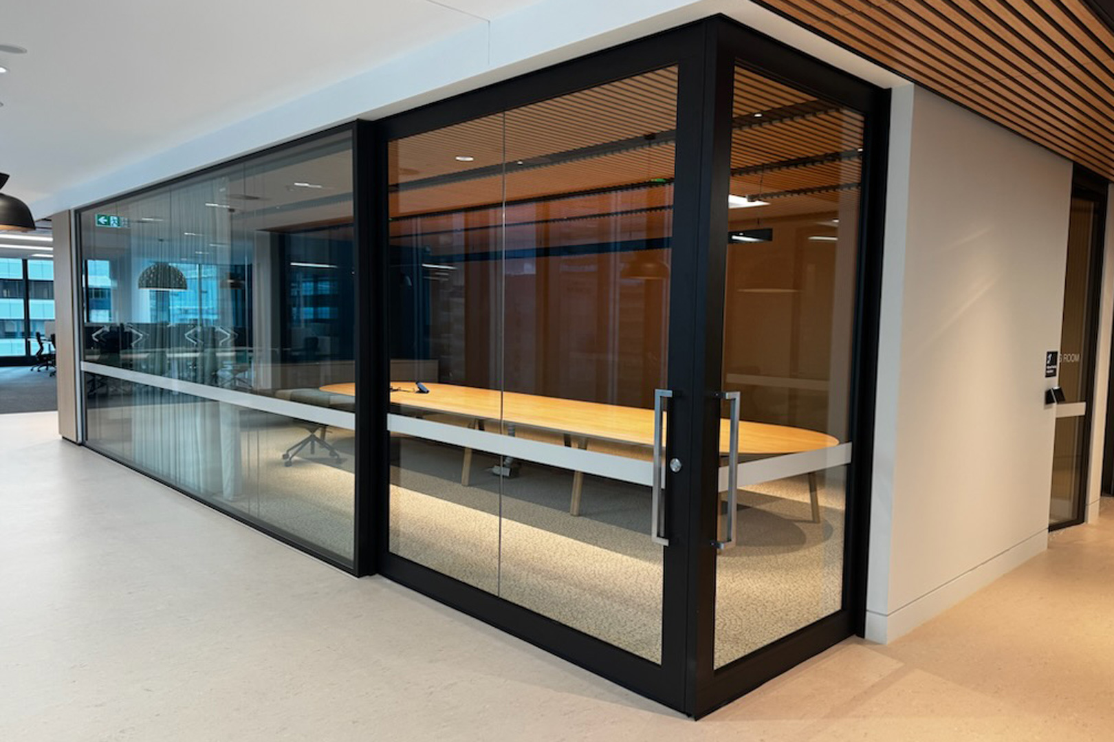 90 degree bi-parting acoustic slider for commercial fitout