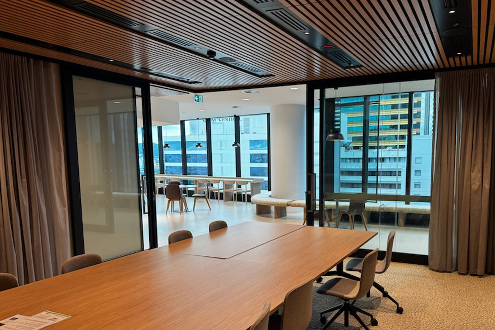 Rw37 rated bi-parting acoustic slider for commercial fitout