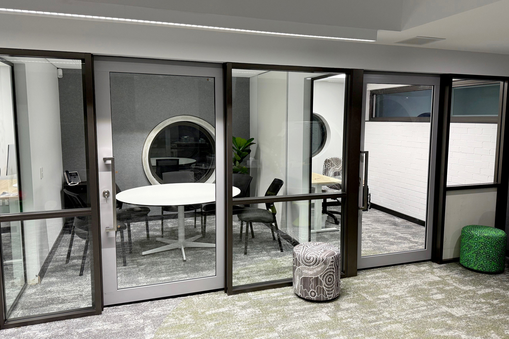 Recess mounted single clear view acoustic sliders installed in a school