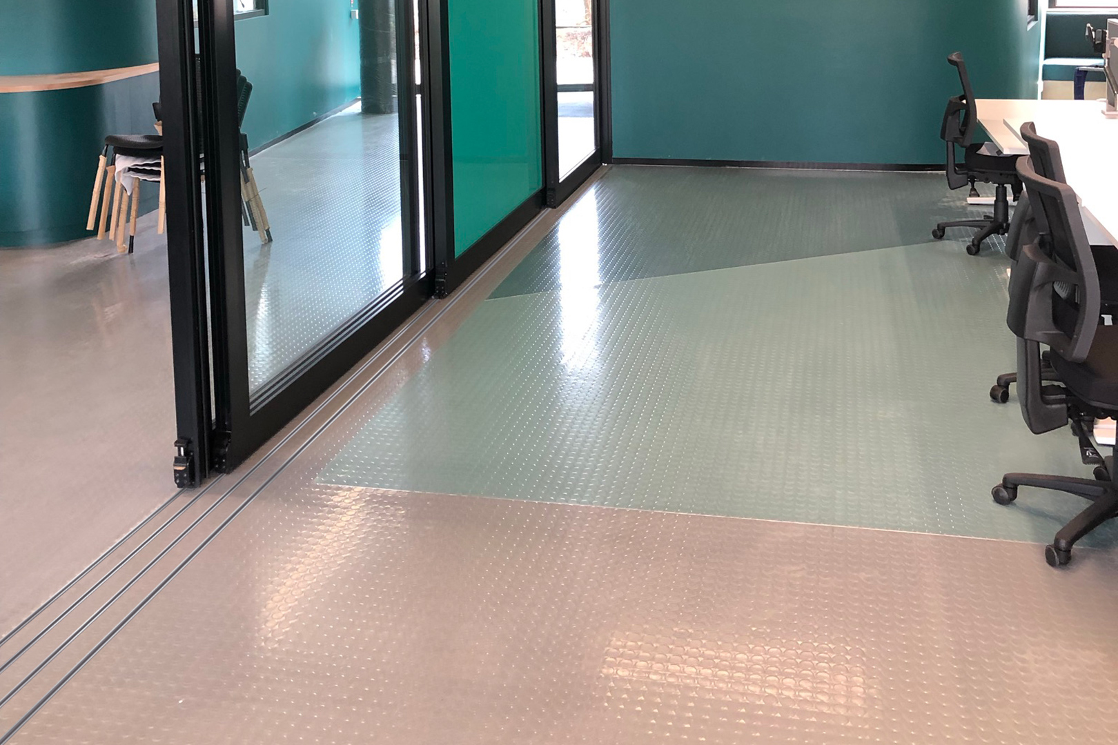 Sereine bottom rolling acoustic sliding door with narrow floor track