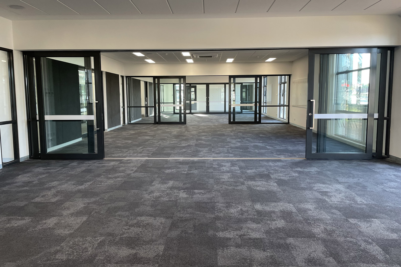 bottom rolling acoustic sliding door system